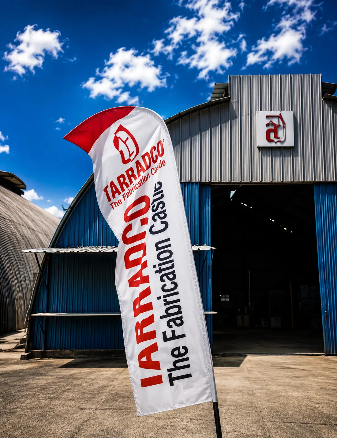 Tarradco — The Fabrication Castle banner outside the group's fabrication workshop